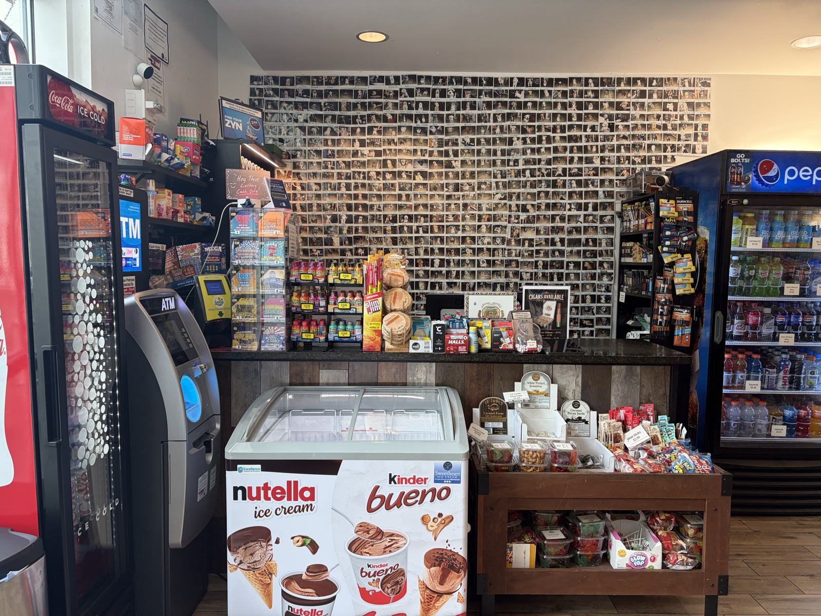 Store counter, coolers, and candy wall inside The Island Shoppe